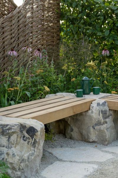 Log and stone bench seating in the Ingham's Working with Nature Garden designed by Joshua Parker and Matthew Butler.