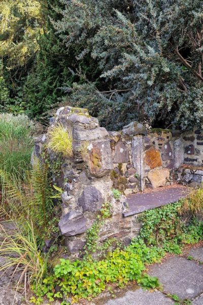 Incorporate seating or raised beds into garden ruins.