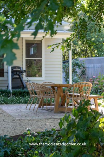 A dining table and chairs in a relaxing mix of wood and cane.