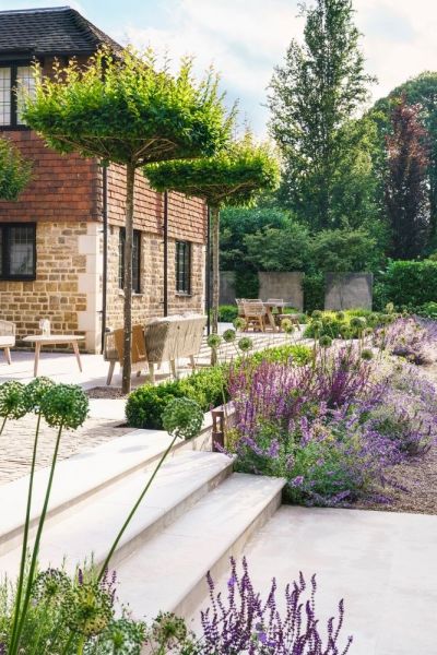 Table top trees in a garden designed by Pollyanna Wilkinson Garden Design