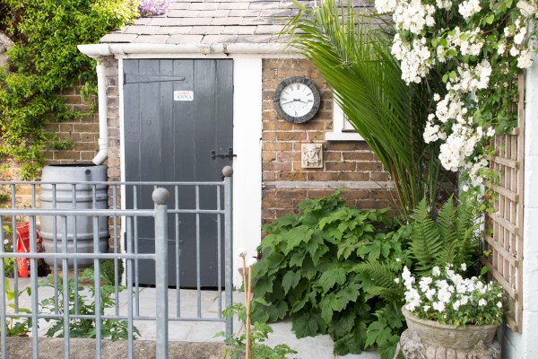 Paint the door to contrast with wood or brick