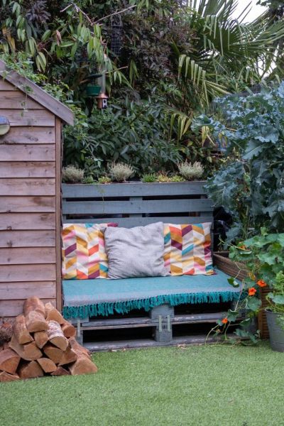 A pallet sofa and planter