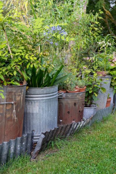 Upcycled bins used as planters for cottagecore style