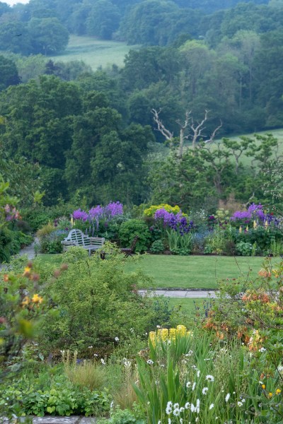 The formal garden at Gravetye with the views beyond