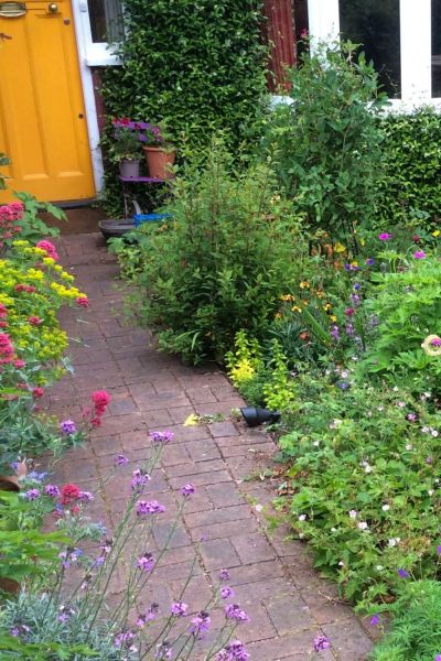 Yellow front with cottage garden plants