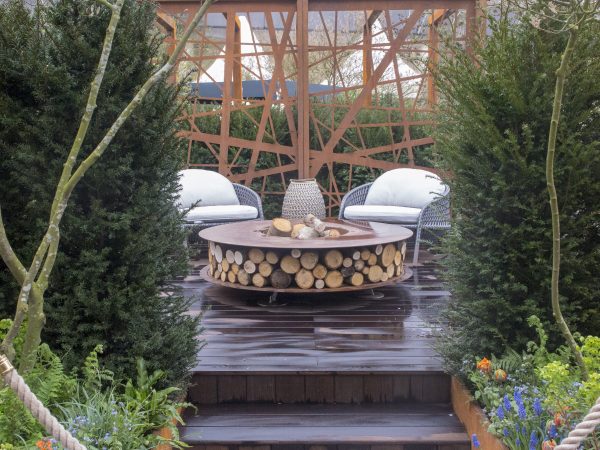 Firepit and laser-cut corten steel screen from Kate Gould Designs