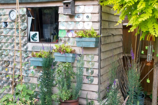 Use CDs to reflect light off your shed