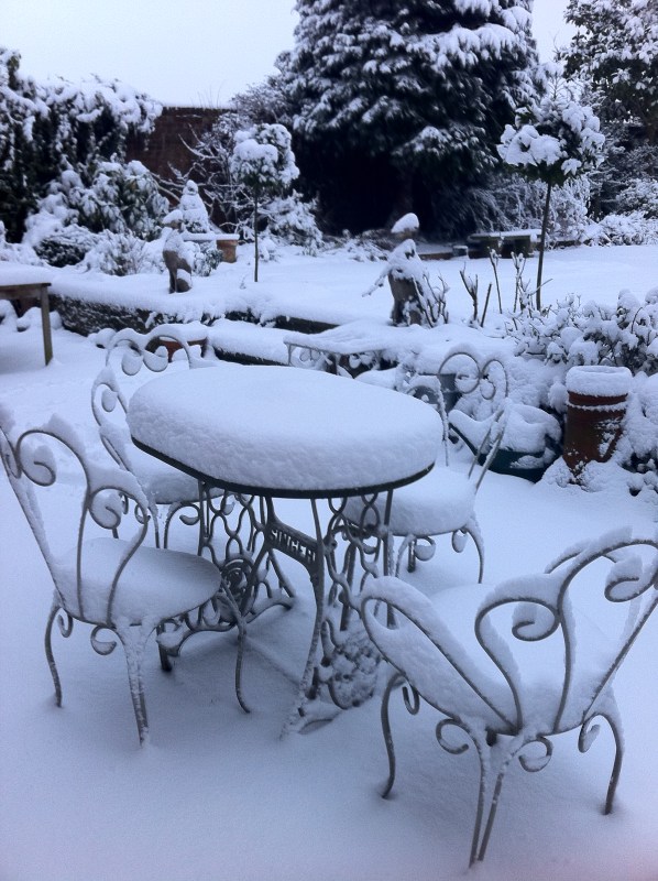 Snow on romantic garden furniture