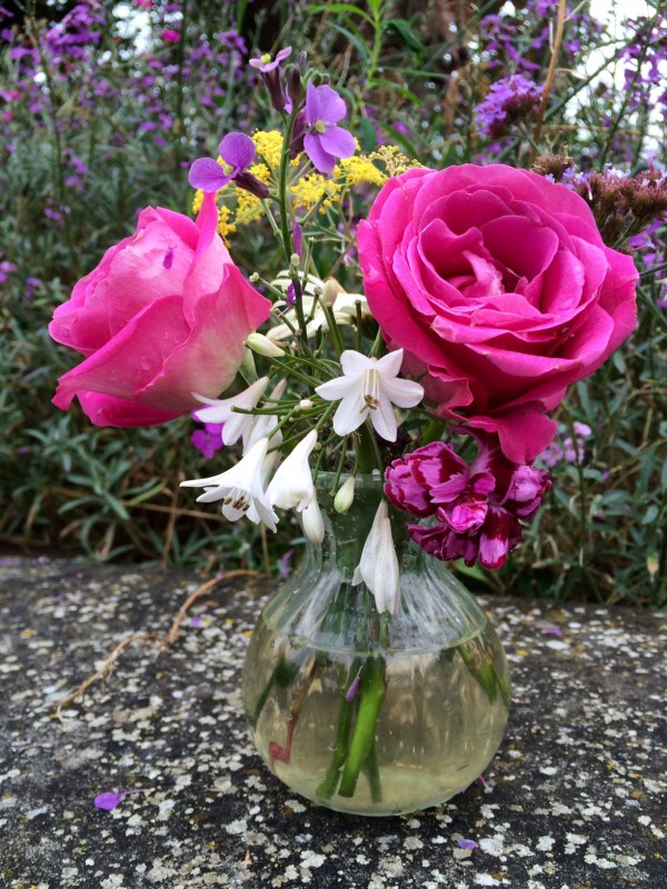 Supermarket roses mixed with garden flowers