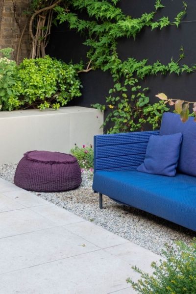 Garden design tips - paint walls and fences dark