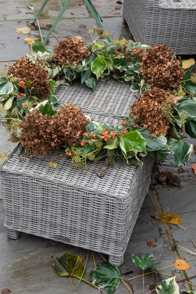 Add hydrangea heads and cotoneaster berries to the wreath